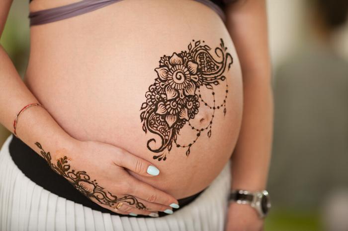 Henna on a pregnant stomach