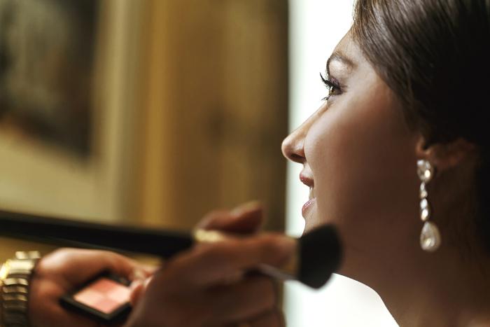 Woman getting her makeup done