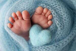 Newborns feet in a swaddle