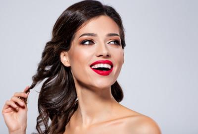 Woman with curly hair and red lipstick