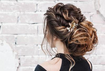 Woman with loose up do and jewelled clip