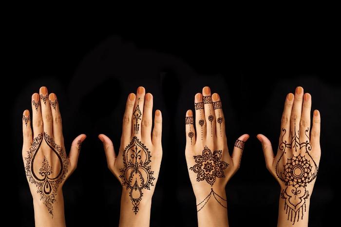Different henna designs on hands