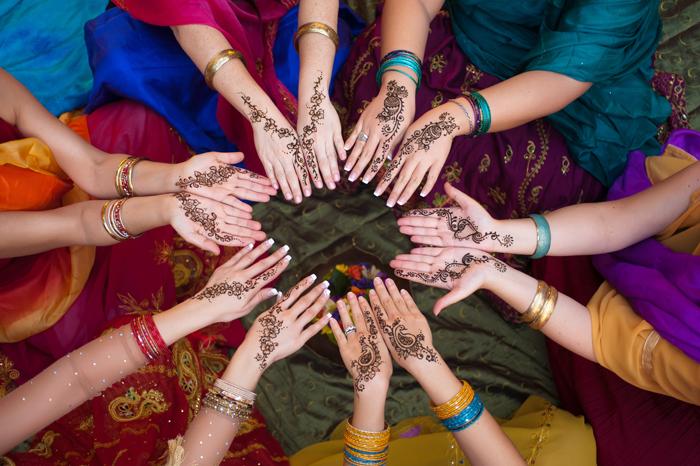 Group of women with henna on their hands